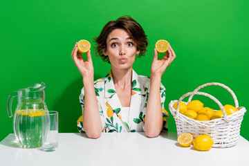 Photo of young girl brown hair pouty lips person she like dieting freshness made by two citrus halves isolated on green color background - obrazy, fototapety, plakaty
