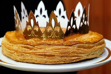 Galette des Rois (French King Cake) with Feve and Crown usually shared on the Epiphany.