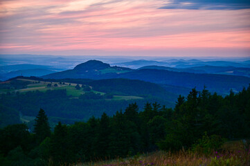 Wasserkuppe - panoramic view from the Radom observatory on the Wasserkuppe in the Hessian Rhön in summer towards Fulda in the sunset, Hessen, Germany	

