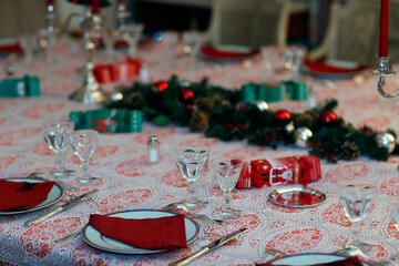 Table served for Christmas dinner in living room. Christmas celebration.