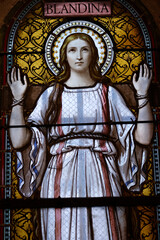 Obraz premium Saint Martin d'Ainay basilica. Stained glass window. Saint Blandina (162Ð177 AD.