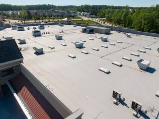 Drone Images of TPO Flat Commercial Roof With Metal Panels: New & Existing Construction 