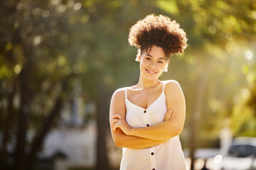 Portrait, black woman and smile outdoor in summer for park walk, fresh air and peace on weekend away. Female person, calm and happy in nature for vacation, adventure or holiday and work break