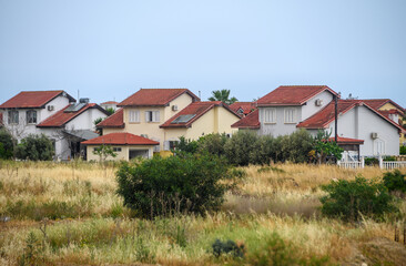 complex of houses with red roofs against the backdrop of the sea in Northern Cyprus 9