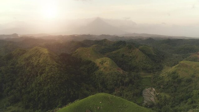 Aerial mountain rainforest view: Bohol Island, Chocolate Hills. Asia tropical green hill with jungle at rural Mount Mayon, Legazpi, Philippines. Philipino green grass valley. Nobody nature summer day