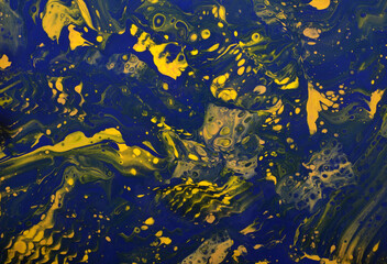 abstract art background in dark yellow and blue colors with cells and splashes