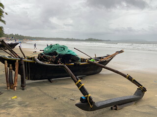 A traditional fishing boat anchored on Palolem beach of South Goa, India.