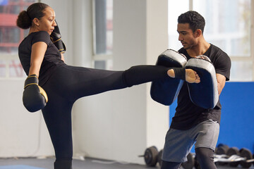 Boxer, woman and trainer with boxing kick for fight workout of muay thai exercise for self defense....