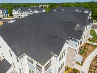 Drone Images of New Residential Apartment Buildings Featuring Architectural Asphalt Shingles On a...