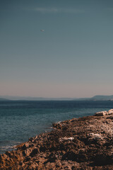 Craggy Shoreline and Calm Waters