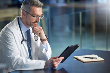 Mature doctor, tablet and man at desk for healthcare, telehealth and notebook for notes on results....