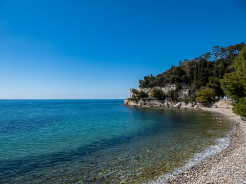Scenic view of majestic historic white Miramare castle in Trieste in Friuli-Venezia Giulia, Italy, Europe. Blue sky in tranquil atmosphere at Adriatic Mediterranean sea in summer. Sightseeing