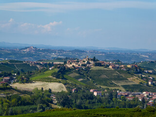 Panoramic view of the famous vineyard in La Morra in Langhe wine region of Piedmont (Piemonte), Italy, Europe.  Luxury couple get away vacation. Romantic tranquil atmosphere in rural area