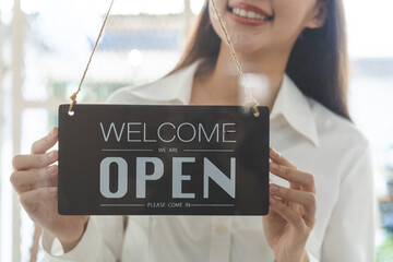 Smiling young asian business owner, employee retail,coffee shop woman,girl turning,setting sign...