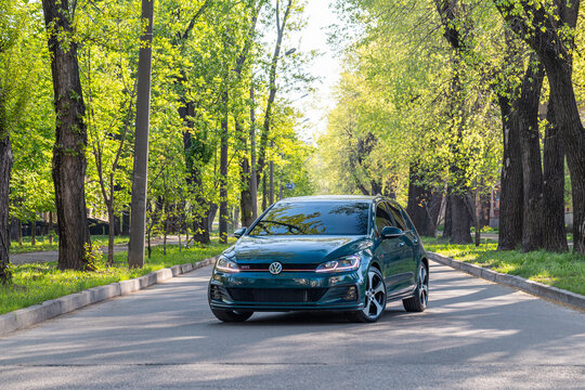 Krivoy Rog, Ukraine - April 14, 2024: Photo of green car Volkswagen Golf GTI on the street.
