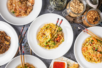 Table Full of Food: An image capturing a bountiful spread of various dishes arranged on a table, showcasing a diverse assortment of cuisines and flavors, ideal for feasts or banquets.