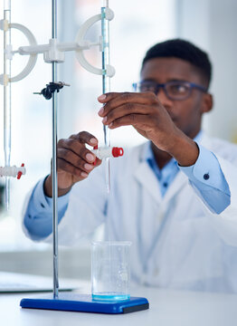 Science, burette clamp and scientist in laboratory with beaker for chemical research with liquid. Innovation, chemistry and man researcher measuring fluid with biotechnology equipment for medical