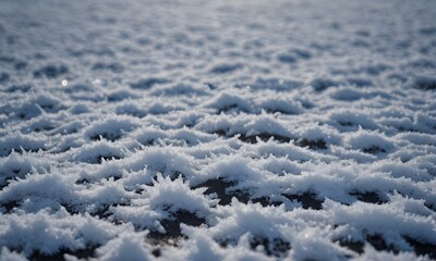 Obraz premium a close up of a snow covered ground with a blurry image of snow flakes and snow flakes