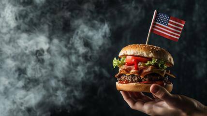 Hand holding a juicy burger with American flag toothpick garnish vibrant smoke in the background...