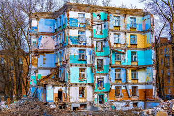 Wall of a destroyed house. Collapse of a multi-story building due to an earthquake, military...