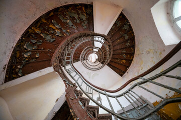 Exploration of the historic old stone mill with a spiral staircase in Southern Poland, Europe, in...