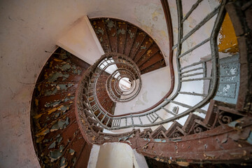 Exploration of the historic old stone mill with a spiral staircase in Southern Poland, Europe, in Winter
