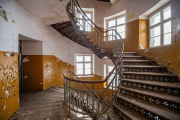 Exploration of the historic old stone mill with a spiral staircase in Southern Poland, Europe, in Winter