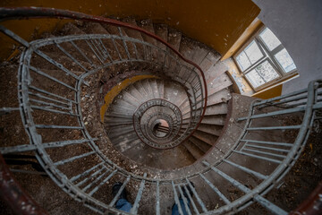 Exploration of the historic old stone mill with a spiral staircase in Southern Poland, Europe, in...