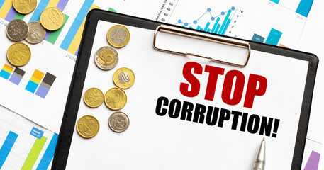 Stop Corruption inscription on clipboard with euro coins and financial graphs. Economic integrity...