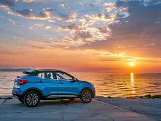 A captivating scene featuring a blue compact SUV car with a sporty and modern design parked on a concrete road by the sea at sunset