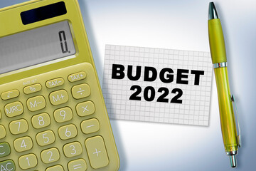 Budget 2022 concept with note, calculator and pen on the table