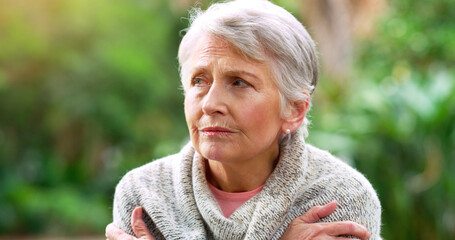 Senior woman, thinking and lonely in park for retirement, pension and anxiety for old age in...