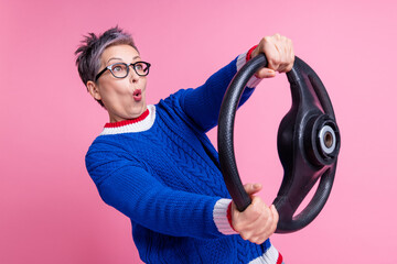 Photo of crazy pensioner funny woman wear stylish clothes test drive lesson speed road empty space isolated on pink color background