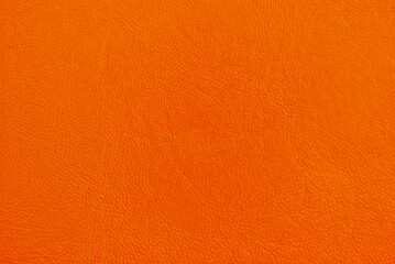 Orange smooth pebbled leather texture pattern as background