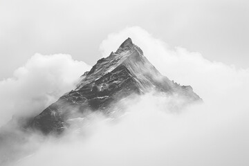 A mountain peak emerging through a layer of clouds, symbolizing resilience and strength.