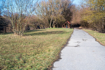 Embankment of the Morava River with asphalt road and lawn. Bratislava.