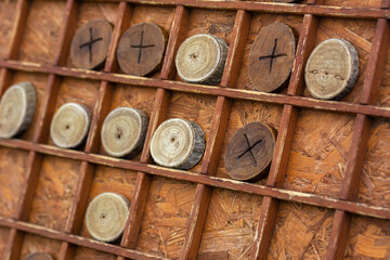 Board game tic-tac-toe on a large wooden board. Family leisure and entertainment. Logical games for...
