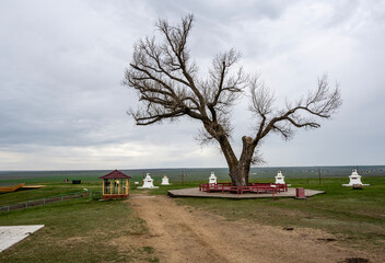 Buddhist temples and symbols against the background of the nature of Kalmykia on a sunny spring day