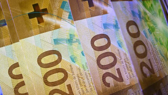 Swiss Francs Rolling in Slow Motion in Bill Counter