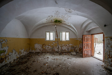 Exploration of the historic old stone mill with a spiral staircase in Southern Poland, Europe, in...