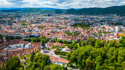 Fototapeta na wymiar Graz, Austria's second-largest city, is a captivating blend of historic charm, modern innovation, and natural beauty. Its well-preserved old town, a UNESCO World Heritage Site captured by drone