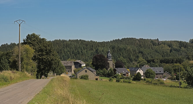 Village of Cens with church, traditional houses and farms in Luxembourgh, Belgium 