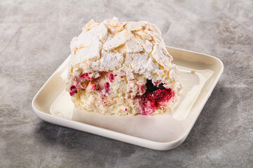 Delicous meringue roll with cherry
