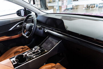 Vehicle with brown seats and steering part in interior