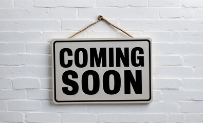 Fototapeta premium Black and white sign hanging on rustic brick wall reads 