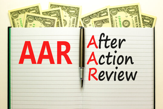AAR After action review symbol. Concept words AAR After action review on beautiful white note. Dollar bills. Beautiful dollar bills background. Business AAR after action review concept. Copy space.