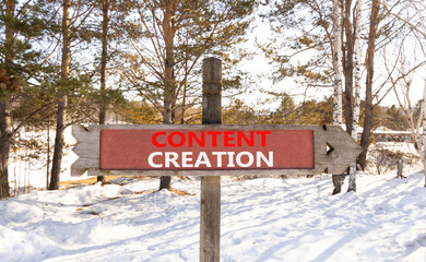 Time for content creation symbol. Concept words Content creation on beautiful wooden road sign. Beautiful forest snow blue sky background. Business time for content creation concept. Copy space.