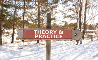 Theory and practice symbol. Concept words Theory and practice on beautiful wooden road sign. Beautiful forest snow blue sky background. Business theory and practice concept. Copy space.