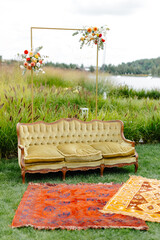 Couch on lush green field
