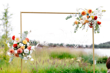 Wedding arch adorned with flowers and greenery